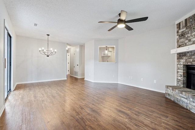 1766 Green Acres Cir, Springdale, AR 72764 - unfurnished living room with a fireplace, wood finished floors, a chandelier, a ceiling fan, and a textured ceiling