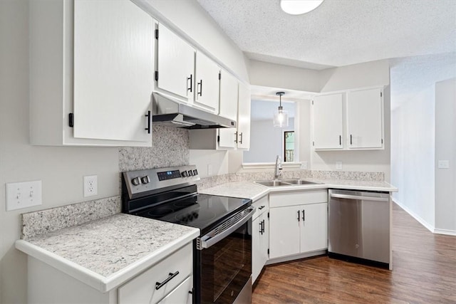 1766 Green Acres Cir, Springdale, AR 72764 - kitchen featuring appliances with stainless steel finishes, under cabinet range hood, white cabinets, dark wood-type flooring, and light countertops