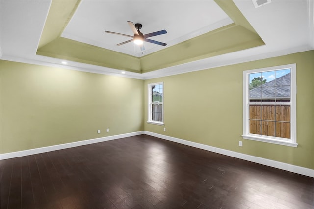 4465 Warwick Cv, Springdale, AR 72762 - unfurnished room featuring a raised ceiling, ceiling fan, healthy amount of natural light, dark wood finished floors, and crown molding