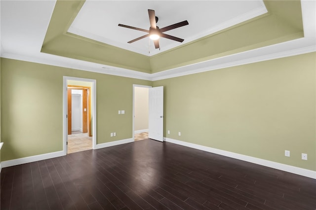 4465 Warwick Cv, Springdale, AR 72762 - unfurnished bedroom featuring a tray ceiling, wood finished floors, crown molding, and a ceiling fan