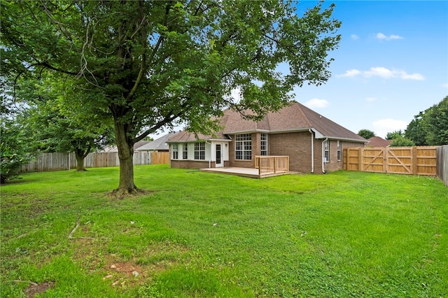 4465 Warwick Cv, Springdale, AR 72762 - back of property featuring a fenced backyard, a deck, and brick siding