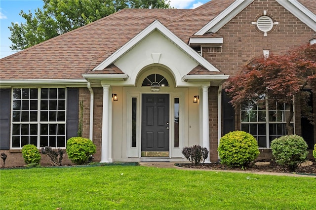 4465 Warwick Cv, Springdale, AR 72762 - view of front of home with brick siding, a shingled roof, and a front yard