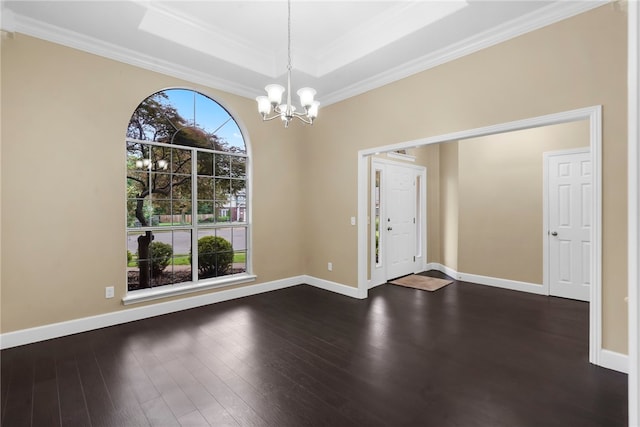 4465 Warwick Cv, Springdale, AR 72762 - foyer featuring a chandelier, a tray ceiling, ornamental molding, and dark wood finished floors
