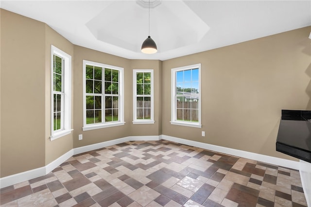 4465 Warwick Cv, Springdale, AR 72762 - unfurnished dining area featuring baseboards and a raised ceiling