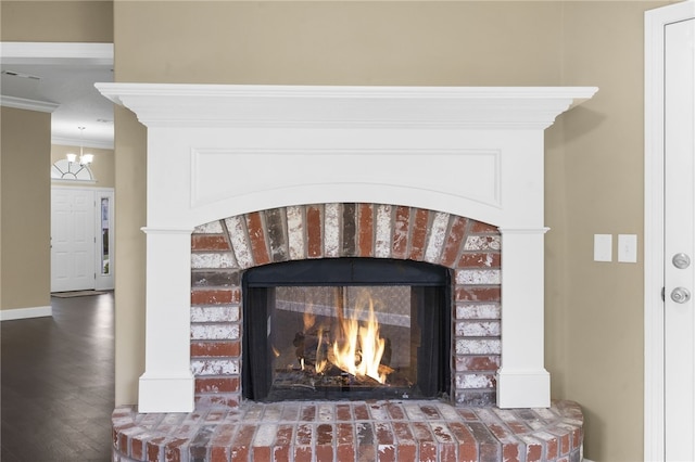 4465 Warwick Cv, Springdale, AR 72762 - detailed view of a fireplace, ornamental molding, and wood finished floors
