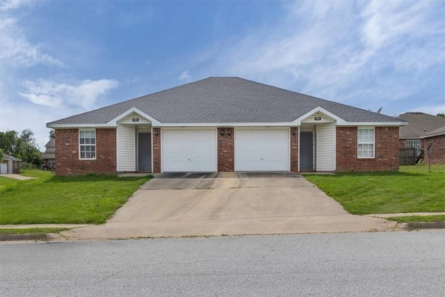 256/258 Graystone Cir, Centerton, AR 72719 - single story home featuring an attached garage, brick siding, concrete driveway, and a front yard