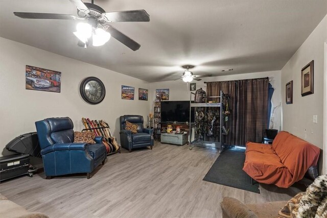 256/258 Graystone Cir, Centerton, AR 72719 - living area featuring ceiling fan and light wood finished floors