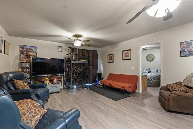 256/258 Graystone Cir, Centerton, AR 72719 - living room featuring ceiling fan and wood finished floors