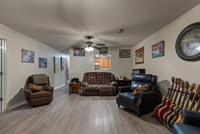 256/258 Graystone Cir, Centerton, AR 72719 - living room featuring wood finished floors and a ceiling fan