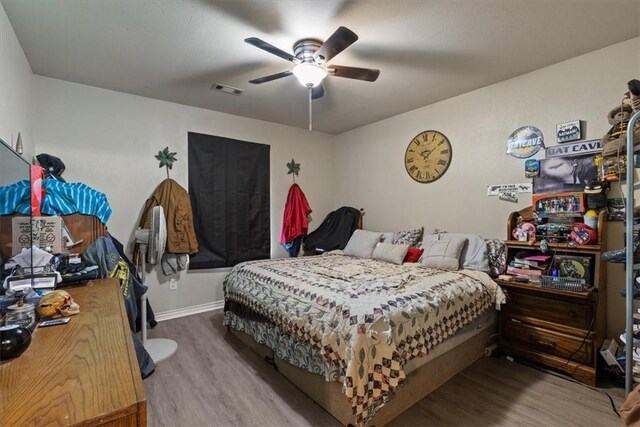 256/258 Graystone Cir, Centerton, AR 72719 - bedroom featuring wood finished floors and ceiling fan