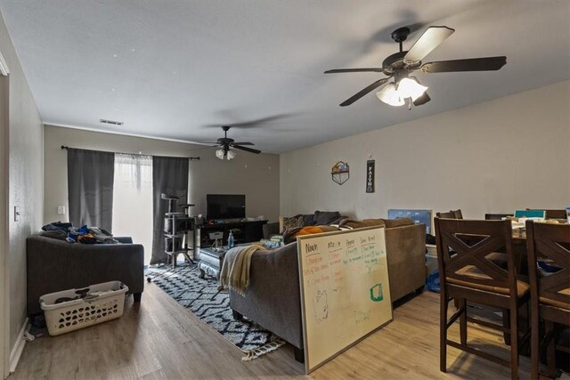 256/258 Graystone Cir, Centerton, AR 72719 - living room featuring ceiling fan and light wood-type flooring