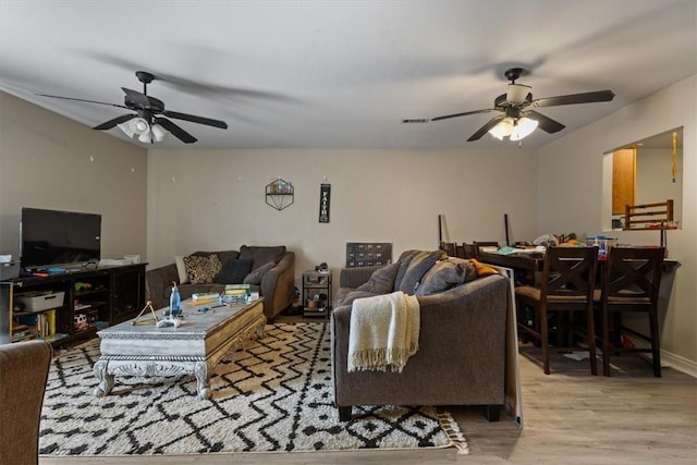 256/258 Graystone Cir, Centerton, AR 72719 - living area with ceiling fan and wood finished floors