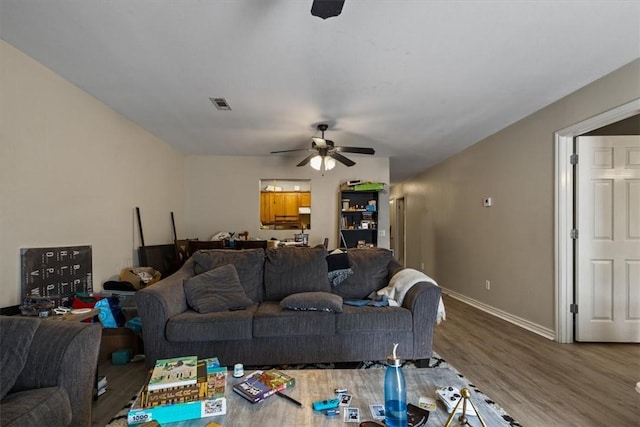 256/258 Graystone Cir, Centerton, AR 72719 - living room featuring a ceiling fan and wood finished floors