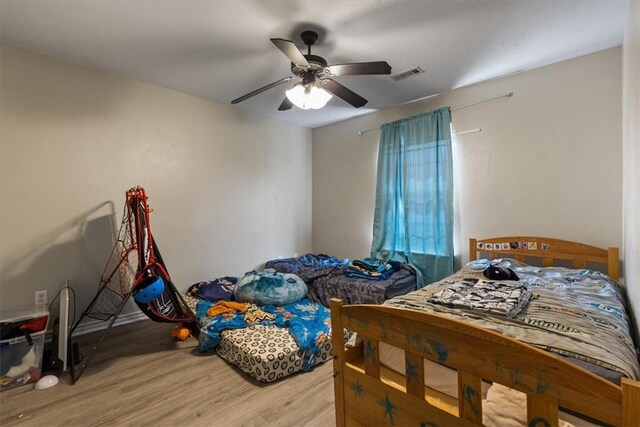 256/258 Graystone Cir, Centerton, AR 72719 - bedroom featuring light wood-style floors and ceiling fan
