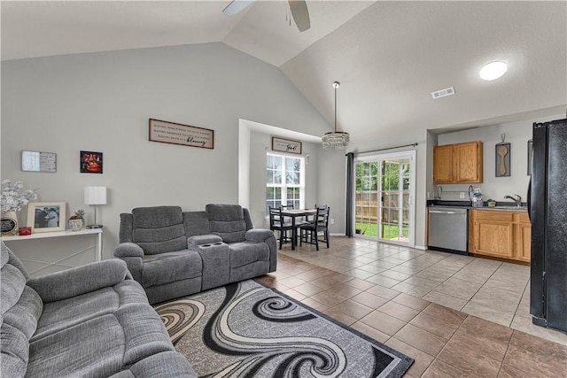 389 Cascade Cir, Springdale, AR 72764 - living area with vaulted ceiling, a ceiling fan, and light tile patterned flooring