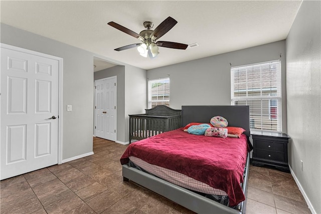 389 Cascade Cir, Springdale, AR 72764 - bedroom featuring baseboards and a ceiling fan