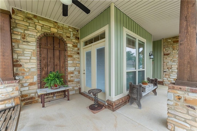 203 Crawford St, Pea Ridge, AR 72751 - property entrance featuring covered porch, stone siding, and ceiling fan
