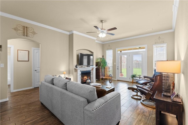 203 Crawford St, Pea Ridge, AR 72751 - living area with a ceiling fan, hardwood / wood-style flooring, a lit fireplace, crown molding, and arched walkways