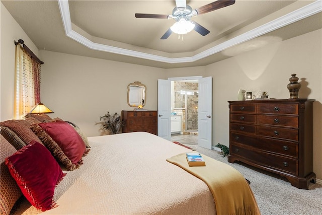 203 Crawford St, Pea Ridge, AR 72751 - bedroom with a tray ceiling, light colored carpet, connected bathroom, and ceiling fan