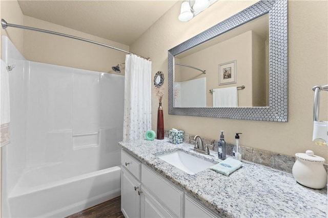 203 Crawford St, Pea Ridge, AR 72751 - bathroom with vanity, shower / bath combination with curtain, and wood finished floors