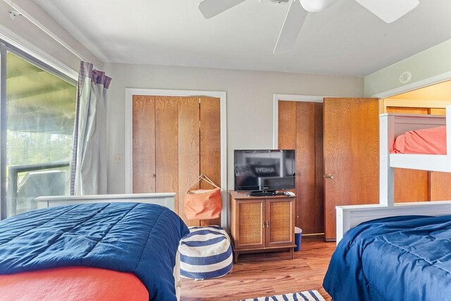 16841 Heritage Bay Rd Unit E-4, Rogers, AR 72756 - bedroom featuring wood finished floors and a ceiling fan