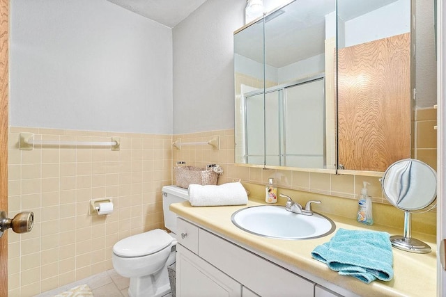 16841 Heritage Bay Rd Unit E-4, Rogers, AR 72756 - full bath featuring vanity, a shower stall, tile walls, and tile patterned floors