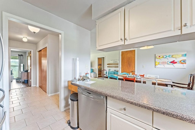 16841 Heritage Bay Rd Unit E-4, Rogers, AR 72756 - kitchen with dishwasher, white cabinetry, light tile patterned floors, and light stone counters