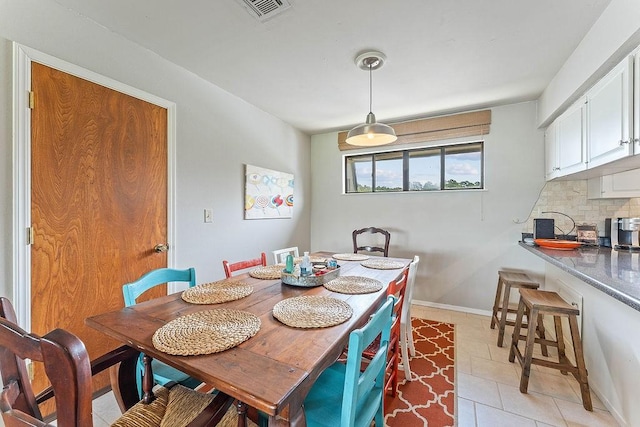 16841 Heritage Bay Rd Unit E-4, Rogers, AR 72756 - dining space featuring light tile patterned floors