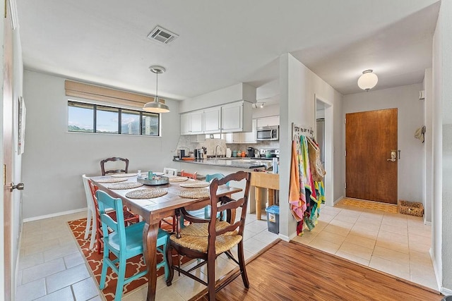 16841 Heritage Bay Rd Unit E-4, Rogers, AR 72756 - dining area featuring light tile patterned floors