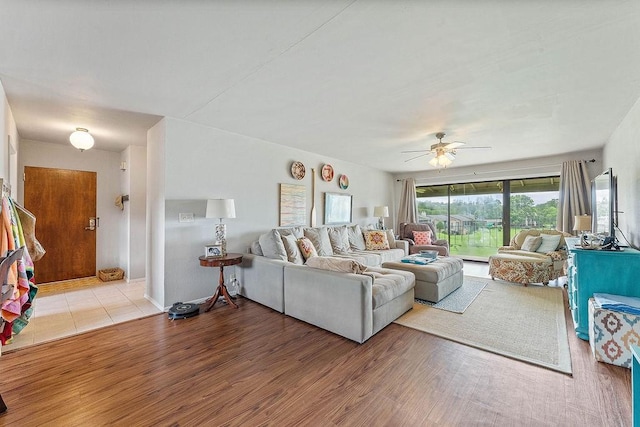 16841 Heritage Bay Rd Unit E-4, Rogers, AR 72756 - living room with wood finished floors and a ceiling fan