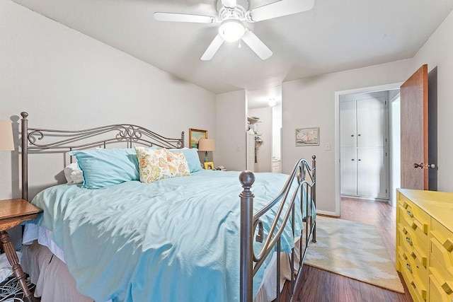16841 Heritage Bay Rd Unit E-4, Rogers, AR 72756 - bedroom with wood finished floors and ceiling fan
