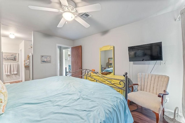 16841 Heritage Bay Rd Unit E-4, Rogers, AR 72756 - bedroom featuring a ceiling fan and wood finished floors