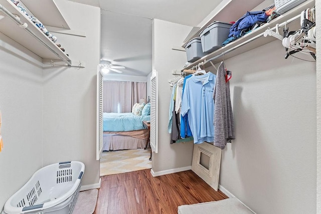 16841 Heritage Bay Rd Unit E-4, Rogers, AR 72756 - spacious closet with wood finished floors and ceiling fan