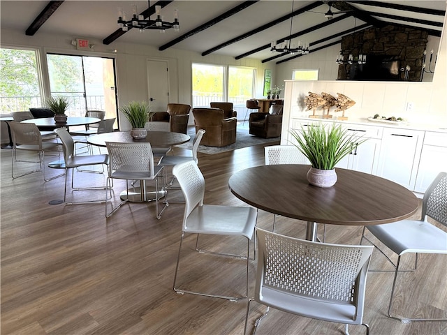 16841 Heritage Bay Rd Unit E-4, Rogers, AR 72756 - dining space with wood finished floors and a chandelier