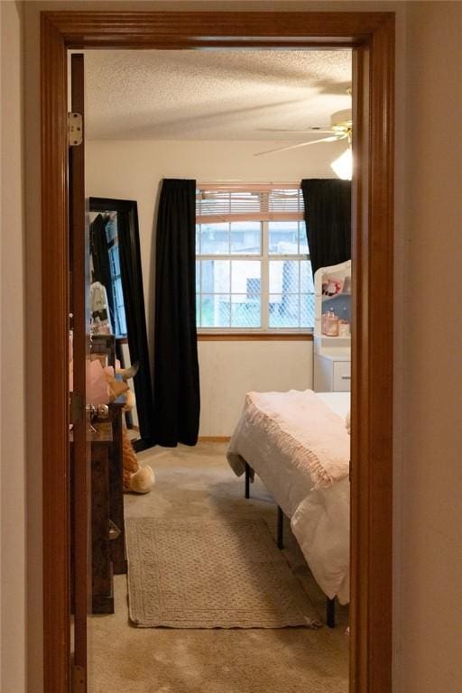 1013 N 26th St, Rogers, AR 72756 - carpeted bedroom featuring a textured ceiling