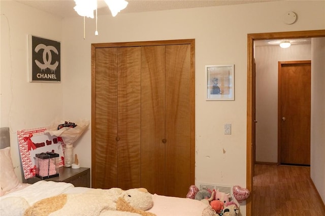 1013 N 26th St, Rogers, AR 72756 - bedroom with wood finished floors and a closet