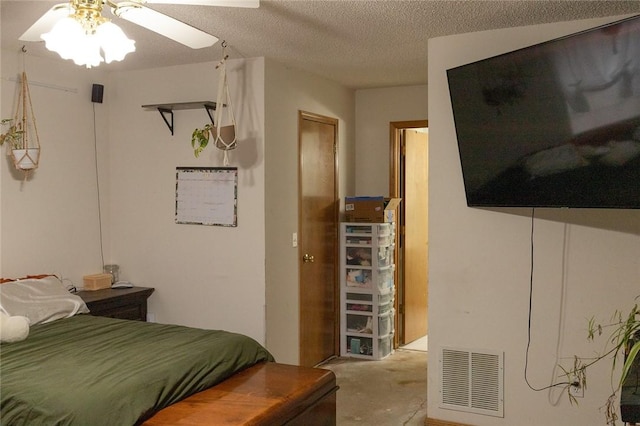 1013 N 26th St, Rogers, AR 72756 - bedroom with concrete floors, a textured ceiling, and ceiling fan