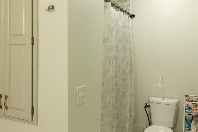 1013 N 26th St, Rogers, AR 72756 - bathroom featuring toilet and a shower with curtain