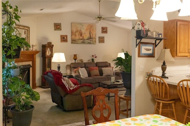 1013 N 26th St, Rogers, AR 72756 - living room with lofted ceiling, ceiling fan, and light colored carpet