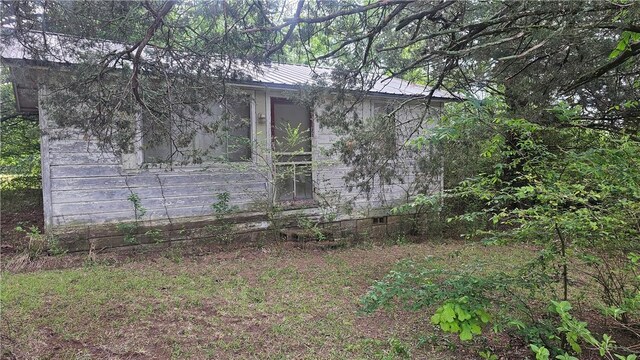 576 E State Highway 393, Delaware, AR 72835 - view of side of home featuring crawl space and a metal roof