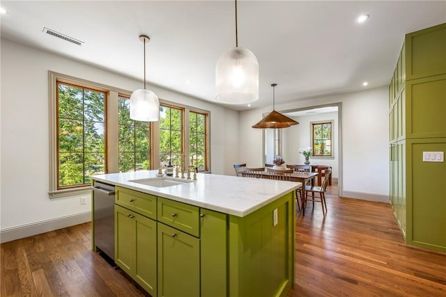 300 NW 5th St, Bentonville, AR 72712 - kitchen with green cabinets, stainless steel dishwasher, dark wood-type flooring, recessed lighting, and a kitchen island with sink