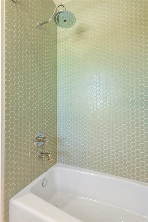 300 NW 5th St, Bentonville, AR 72712 - bathroom featuring tub / shower combination