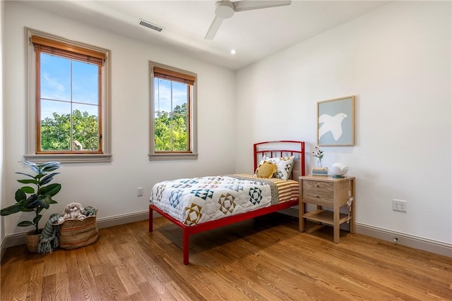 300 NW 5th St, Bentonville, AR 72712 - bedroom with light wood finished floors and a ceiling fan