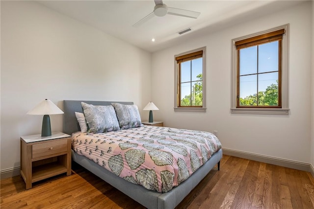 300 NW 5th St, Bentonville, AR 72712 - bedroom with wood finished floors, ceiling fan, and recessed lighting