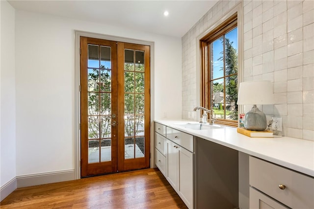 300 NW 5th St, Bentonville, AR 72712 - doorway to outside featuring french doors, healthy amount of natural light, wood finished floors, and recessed lighting