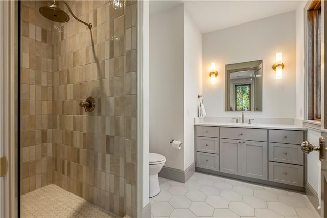300 NW 5th St, Bentonville, AR 72712 - bathroom with tiled shower, tile patterned flooring, and vanity