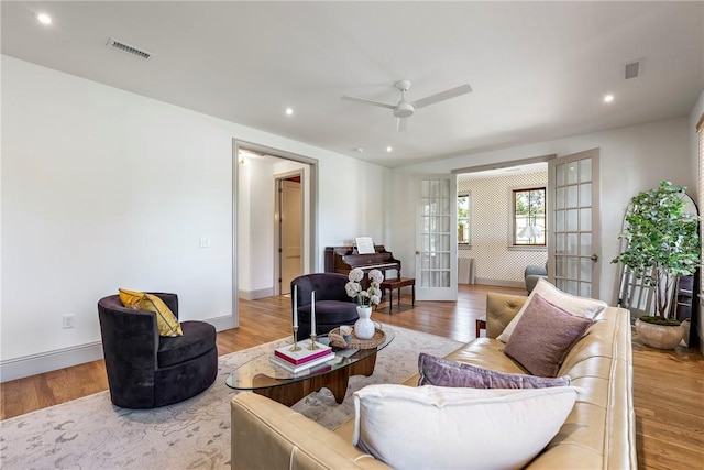 300 NW 5th St, Bentonville, AR 72712 - living area featuring french doors, a ceiling fan, wood finished floors, and recessed lighting