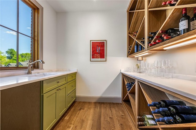 300 NW 5th St, Bentonville, AR 72712 - wine area with a sink and light wood-style floors