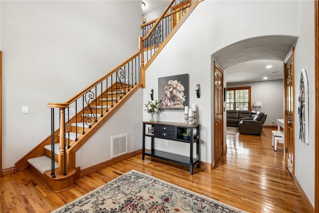 2 Conner Ln, Rogers, AR 72756 - staircase with arched walkways and wood finished floors