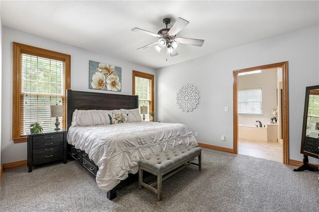 2 Conner Ln, Rogers, AR 72756 - bedroom featuring light carpet, multiple windows, connected bathroom, and a ceiling fan